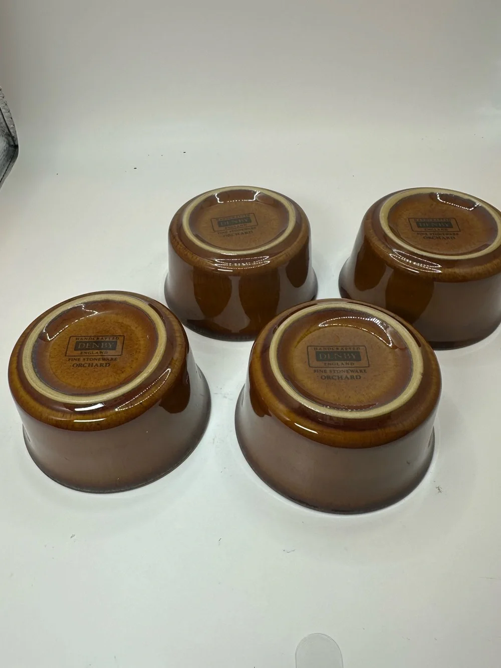 Set of 4 Denby Orchard Stoneware Ramekins feature a glossy brown Glaze.